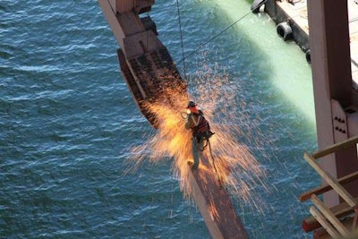 Grand Prize winner Martin Chandrawinata captured this photo of an iron worker using a cutting torch on the San Francisco-Oakland Bay Bridge. (Photo: Martin Chandrawinata, via AASHTO)