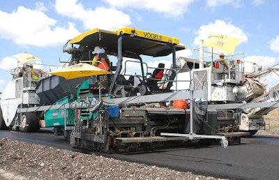 On S.H. 130, Central Texas Toll Road, Roadtec MTVs (Shuttle Buggies) feed pavers with skis with sensors providing input for automatic-leveling controls.