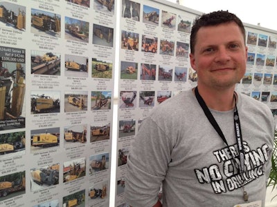 At ICUEE 2013, Bob Martin, HDD Broker’s general manager, stands in front of a listing of used drills available from his company.