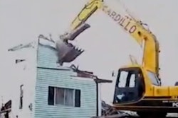 excavator demoing house in 40 seconds