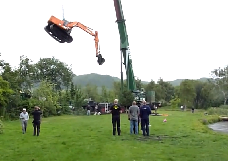crane rescues excavator