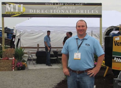 Kevin Smith, MTI’s general manager, in front of the company’s booth at ICUEE 2013.