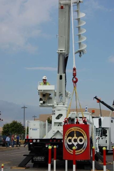 Are you this good? Roy Bolton, crane operator training coordinator at Cianbro, moves a load through an obstacle field, demonstrating one of the hands-on tests required for certification.