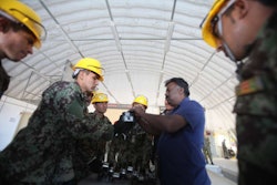 U.S. Marines train Afghan National Army soldiers on how to maintenance heavy equipment as part of the Heavy Equipment Maintenance Course at the engineer lot on Camp Shorabak. Credit: Sgt. Bryan Peterson