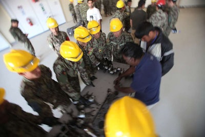 Afghan National Army soldiers with the 215th Corps’ Engineer Kandak learn engine components of a 7-ton truck during the Heavy Equipment Maintenance Course. Credit: Sgt. Bryan Peterson