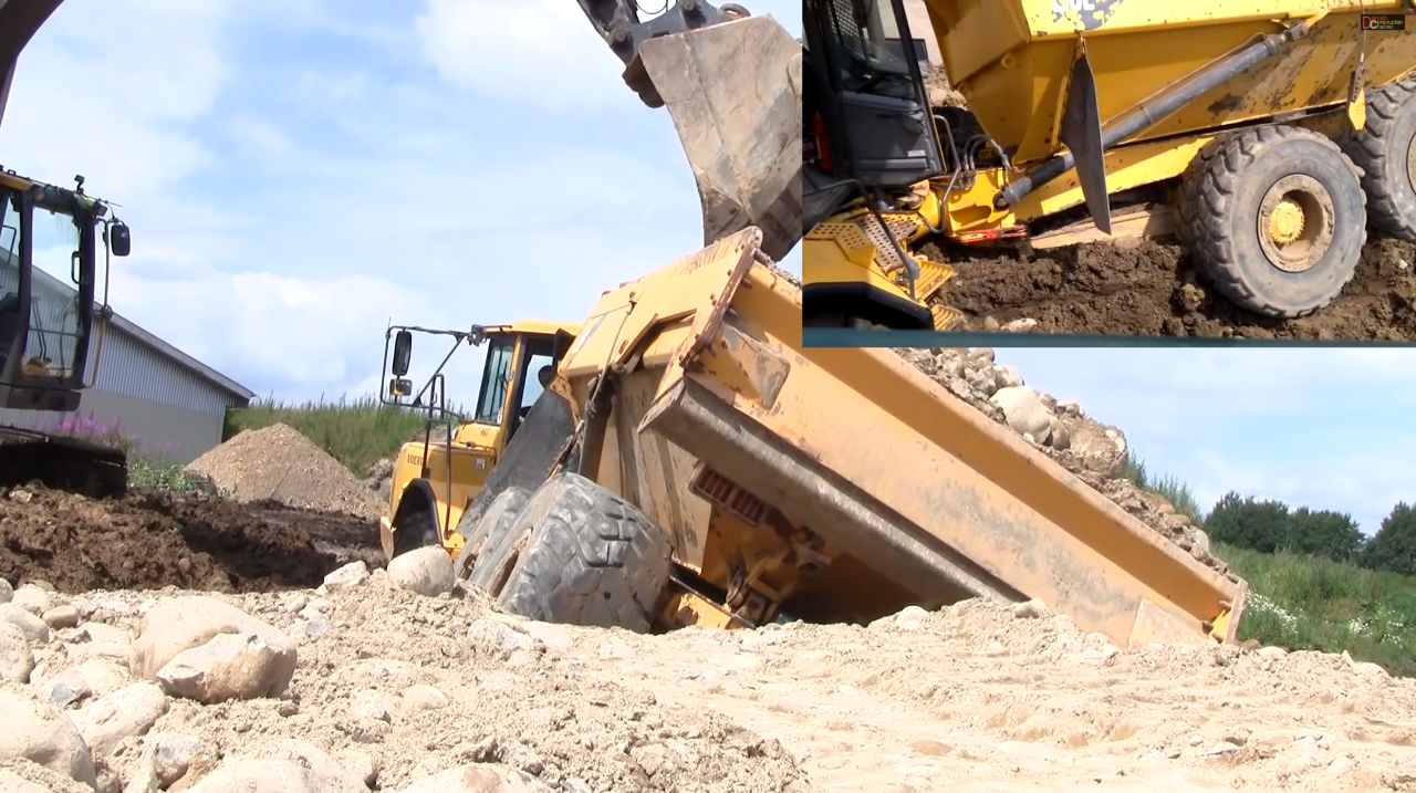 Stuck Volvo A30 rescued by excavator