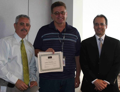 Basem E. Muallem, P.E., Caltrans District 8 director (right) and Stephen R. Pusey, Caltrans District 8 deputy director of maintenance (left) present John Hubbs, APM, Caltrans area superintendent, with the inaugural International Pavement Association (IPMA) Award of Excellence. (Photo: Mario C. Maala/Caltrans District 8)
