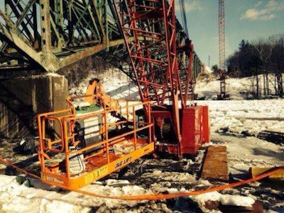 Construction equipment frozen below a bridge undergoing repairs on I-91 in Brattleboro, Vermont. Credit: Chris Mays/Brattleboro Reformer