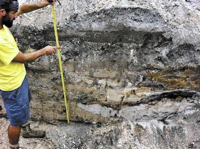 An archaeologist shows the area where the 2,000-year-old remains were found. Credit: Archaeological and Historical Conservancy