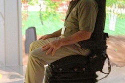 Phil Newberry sits in the Cat Immersive Visualization Center.