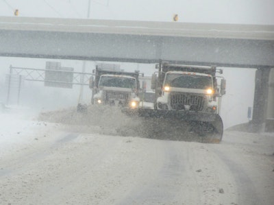 Tandem plows out of the Independence, Ohio, maintenance facility, work together to clear Interstate 480 near Ridge Road faster.