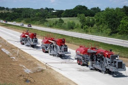 Spreading should begin a minimum of 1 foot from the shoulder, with each pass of the grinder moving the spread¬ing operation farther down the slope to ensure no build-up of grinding residue.