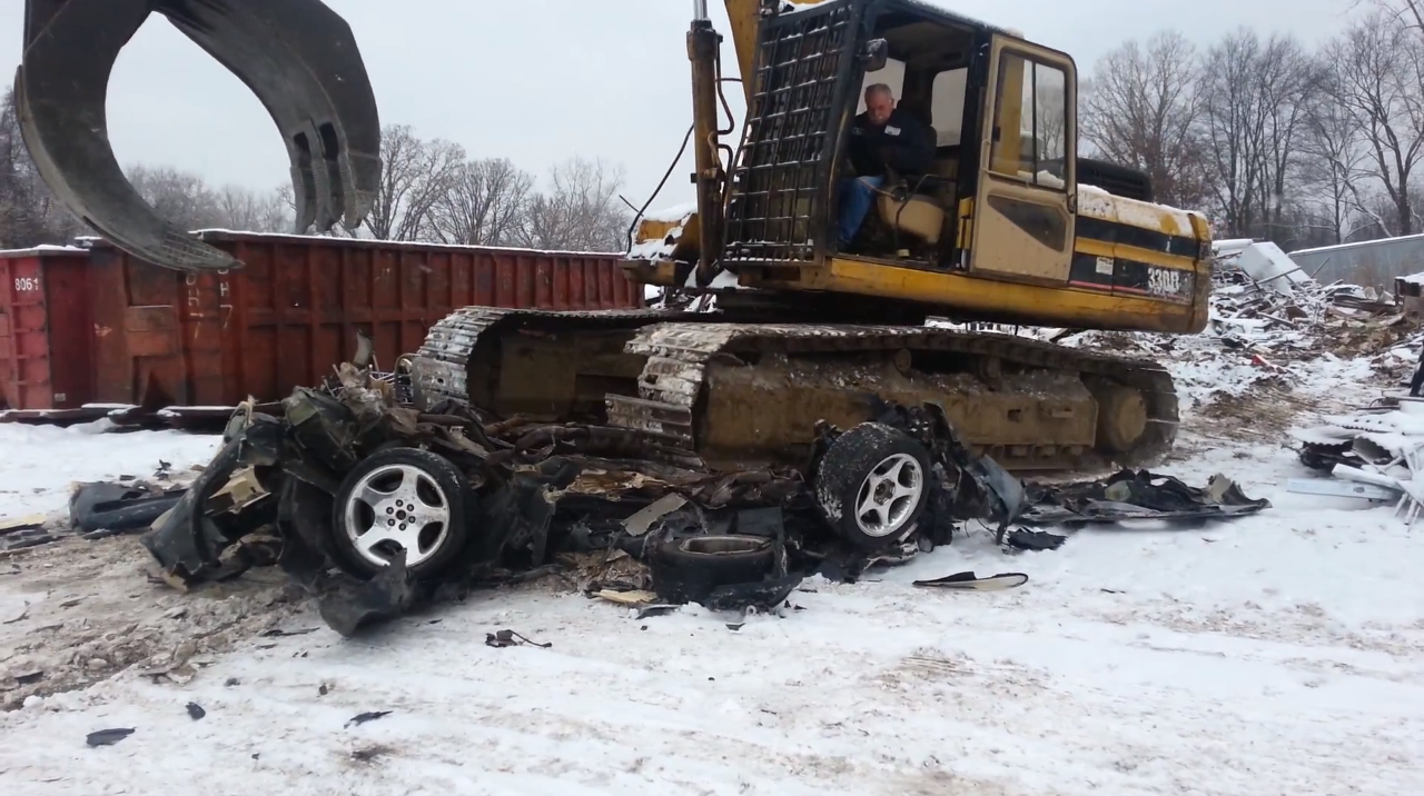 Excavator destroys Dodge Viper