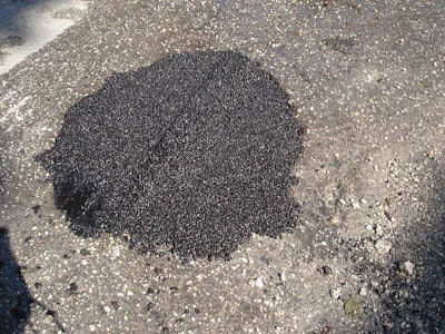 Engineered, proprietary polymer modified pothole patching mixes permit permanent patches under winter working conditions. (Photo courtesy of EZ Street Inc.)