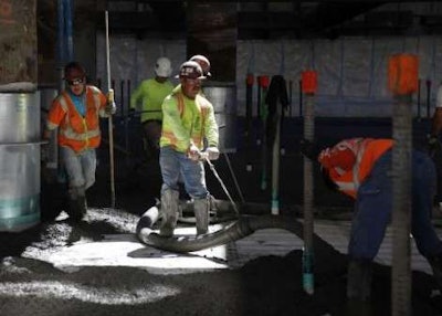 Workers pour concrete at the Transbay Transit Center construction site last year. Credit: San Francisco Chronicle