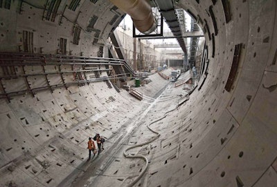 What Big Bertha leaves behind. Two workers walk through the first rings of tunnel dug by Big Bertha in October. Credit: WSDOT Flickr