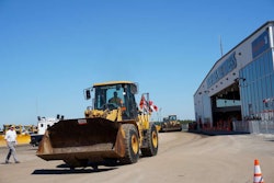 A wheel loader is driven away from the auction ramp during the 2014 Ritchie Bros. Orlando auction.