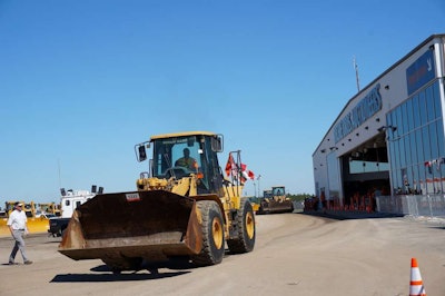 A wheel loader is driven away from the auction ramp during the 2014 Ritchie Bros. Orlando auction.