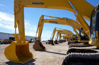 A row of excavators at the Ritchie Bros. Orlando auction lot.