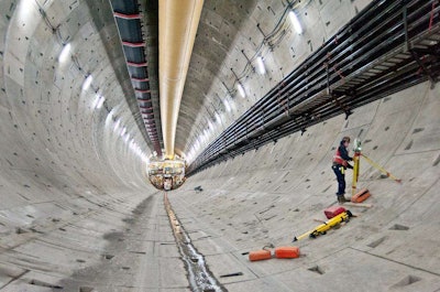 A surveyor sets up his equipment inside the SR 99 tunnel beneath Seattle. Tunnel-boring machine Big Bertha has completed 1,000 feet of the tunnel.