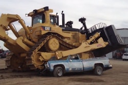 Cat D11T runs over old pickup truck