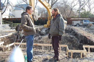 Vern Larman, left, talks with Robert Wolf at a pool jobsite