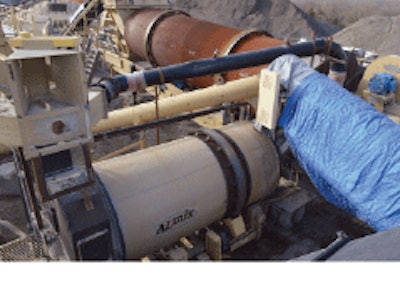 Ideker uses a dual-drum asphalt plant and enters the shingles through a chute between the drying drum and the mixing drum.