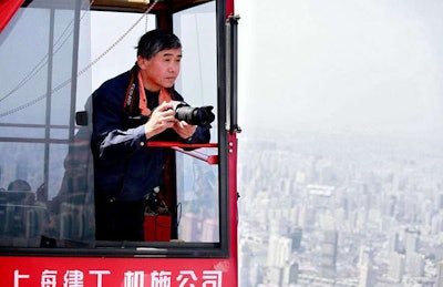Crane operator Wei Gensheng shooting from his perch high above Shanghai.