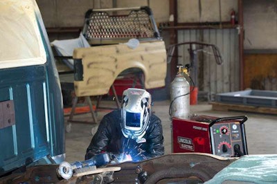Warren Spears making repairs on an older F-150.