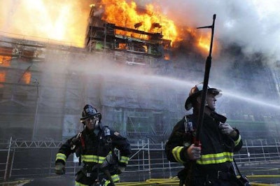 San Francisco firefighters battling back a massive five-alarm blaze in Mission Bay. Credit: Michael Macor, The San Francisco Chronicle