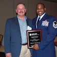 Thad Pirtle, of Traylor Brothers and the 2015 chairman of AEMP, with the 2014 Technician of the Year, Air Force Master Sgt. James C. Thomas III. Early in his career, Pirtle was the second recipient of the Technician of the Year award.