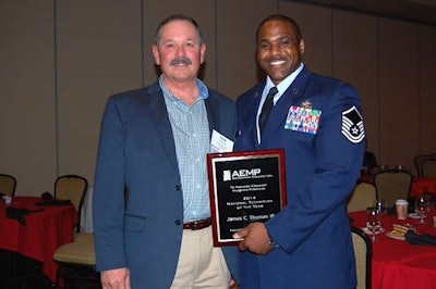 Thad Pirtle, of Traylor Brothers and the 2015 chairman of AEMP, with the 2014 Technician of the Year, Air Force Master Sgt. James C. Thomas III. Early in his career, Pirtle was the second recipient of the Technician of the Year award.