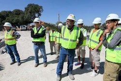 Project superintendent Dale Nieder takes Highlands High School students on a tour of their new buildings. Credit: San Antonio Express-News