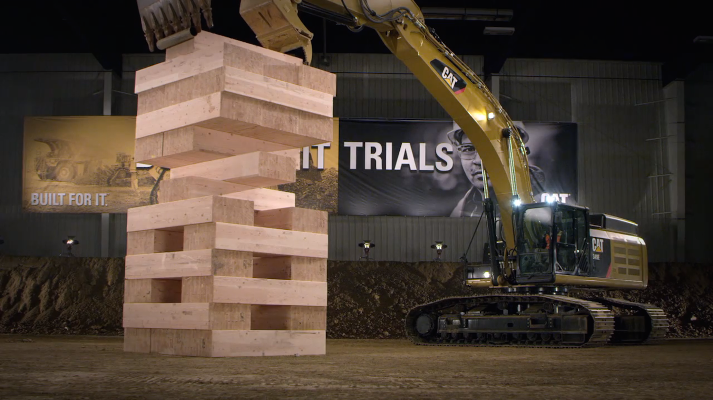 Caterpillar excavators stack 600lb. blocks in the biggest game of
