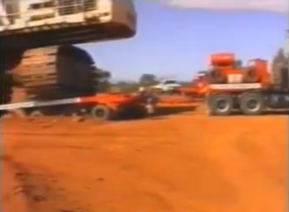Dozer towing truck towing excavator