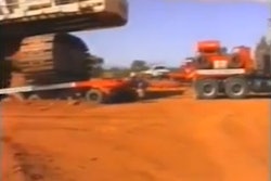 Dozer towing truck towing excavator