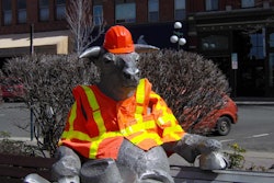 “The Bull” in Ellensburg, Washington sports an orange vest and hardhat during National Work Zone Awareness Week. (Photo courtesy of Kittitas County Public Works)