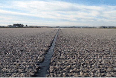 On a California airport runway, longitudinal joints were routed and filled with hot applied sealant in advance of polymer modified thin overlay.