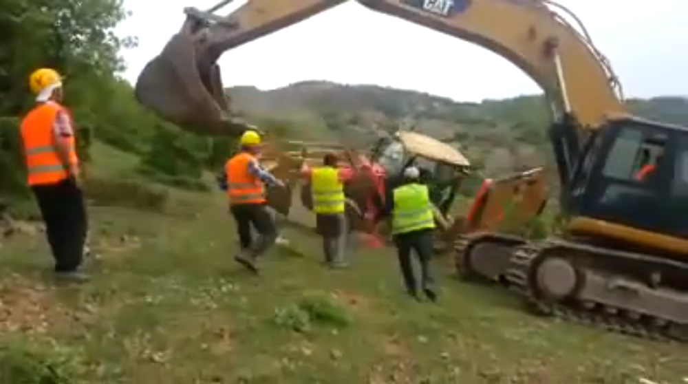 Backhoe down hill