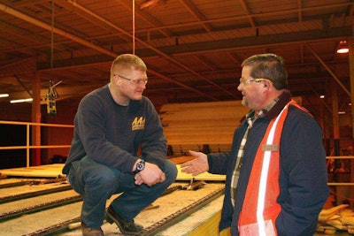 Jobsite chaplain Dan Schallmo, of Marketplace Chaplains, speaks with a construction worker.