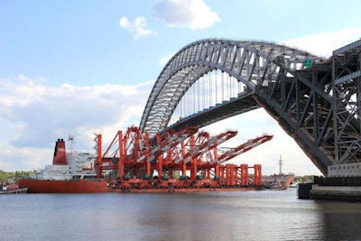 The cranes pass beneath Bayonne Bridge en route to Newark Bay. Credit: S.P. Sullivan/NJ.com