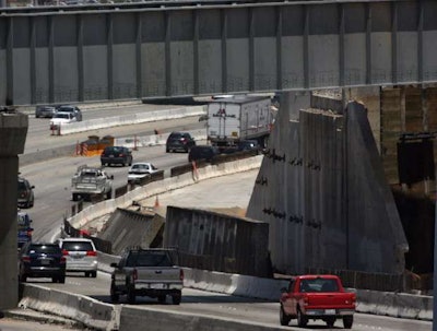 A section of a collapsed railroad bridge that pulled one worker to his death on May 18 lies on the side of Highway 91 in Riverside, California. Credit: Kurt Miller/The Press-Enterprise