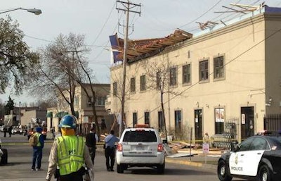 A wall from a third-floor addition under construction hangs over the side of a mall in Minneapolis. Credit: Bruce Bisping/Minneapolis Star-Tribune