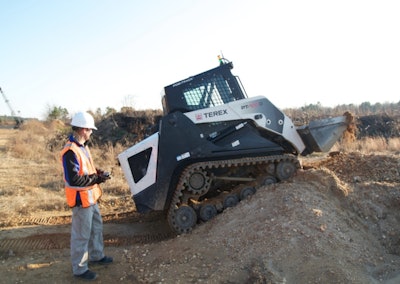 An operator drives a Terex PT-100G skid steer using HRI’s Xbox-like controller. Credit: HRI