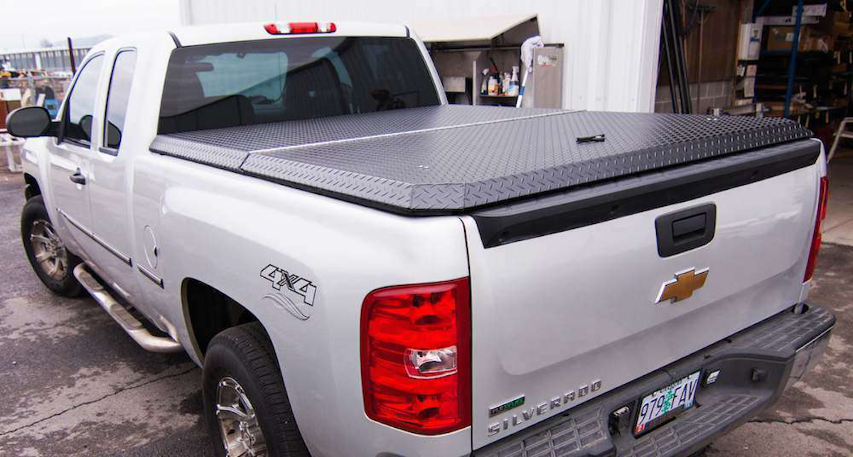 Aluminum tonneau cover provides lightweight, rugged and versatile protection for the gear in