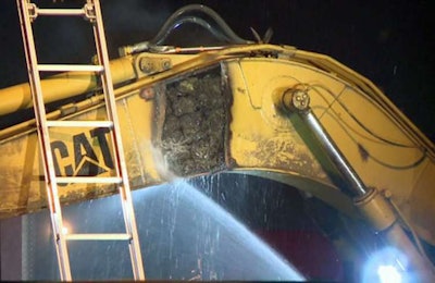 Houston police found 60 bricks of marijuana inside the excavator. Credit: KHOU TV