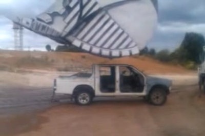 Mining excavator flattens pickup