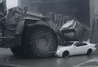 Wheel loader crushes Mercedes Benz