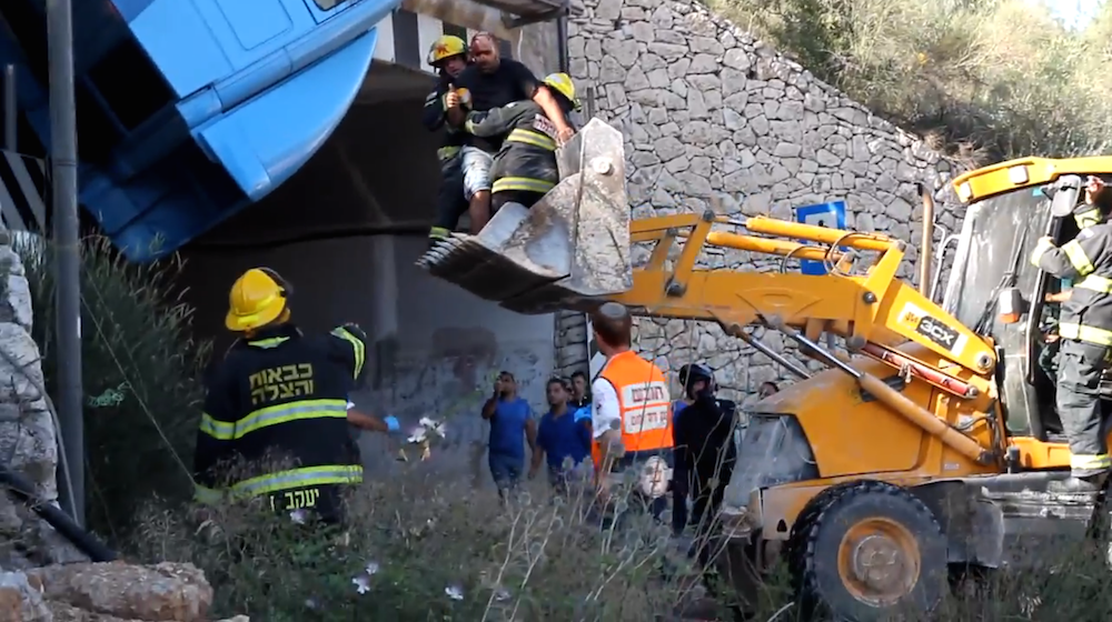 backhoe rescue of truck driver over tunnel Israel