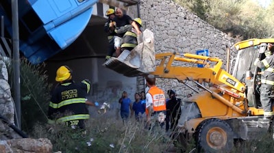 backhoe rescue of truck driver over tunnel Israel